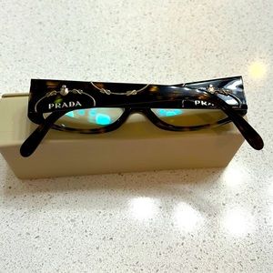 Prada eyeglass frames.